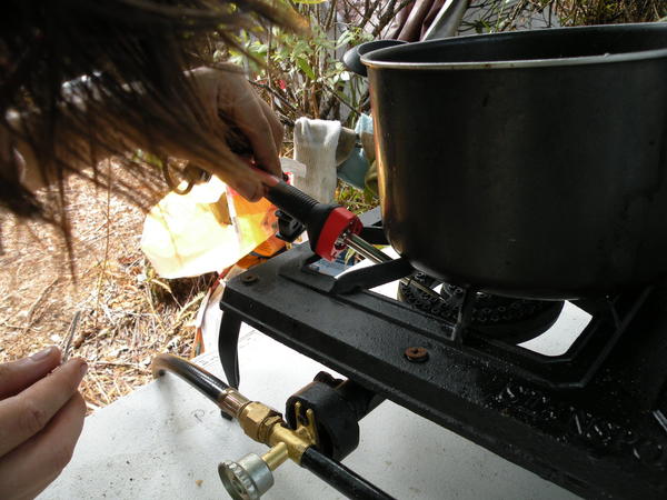 heating the soldering iron with the stove